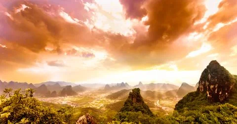 Dramatic sunset over karst landscape from moon hill in yangshuo Stock Photos