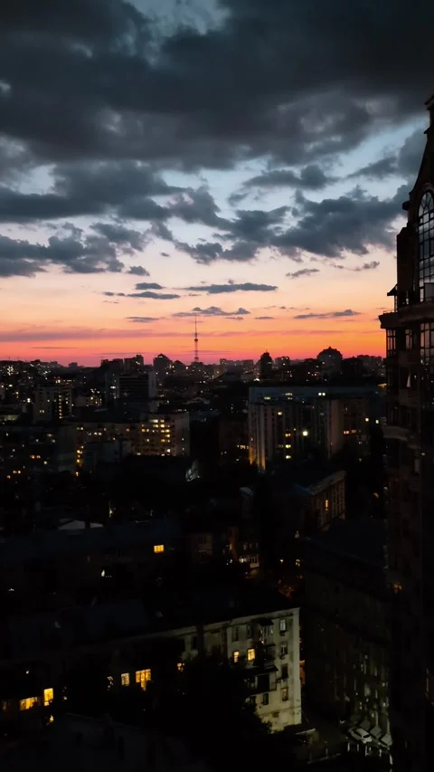 Dramatic Sunset Over Kyiv Skyline with City Lights, Kyiv, Ukraine. Vertical.. Stock Footage 297264986