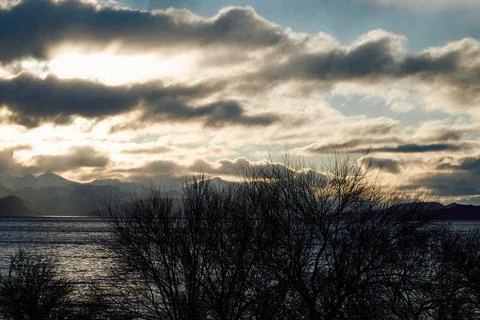 Dramatic sunset over the lake and trees Stock Photos