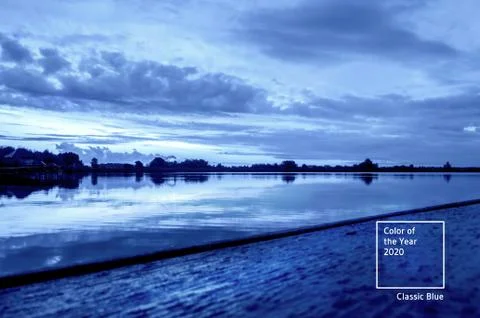 Dramatic sunset over the lake. Stock Photos