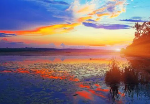 Dramatic sunset over the lake Stock Photos