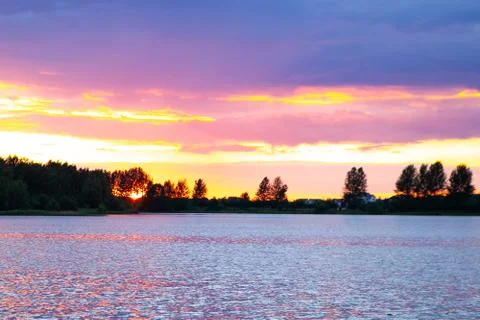 Dramatic sunset over the lake Stock Photos