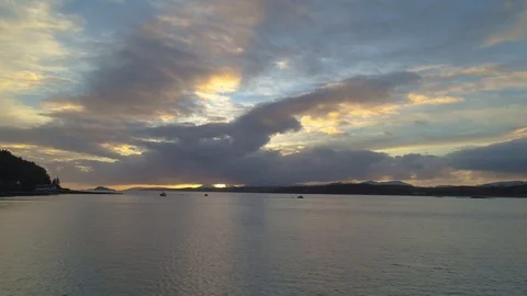 Dramatic sunset over large expanse of water Stock Footage 102412973