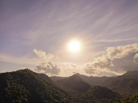 Dramatic Sunset over Lush Tropical Mountain Range and Valley Stock Photos