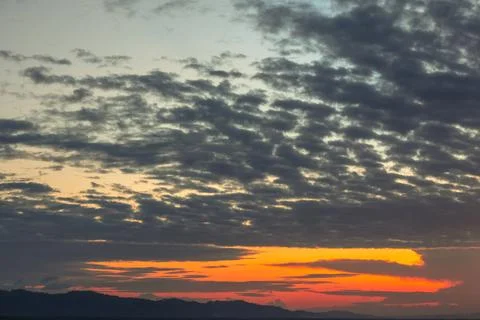 Dramatic Sunset Over Mountain Range Stock Photos