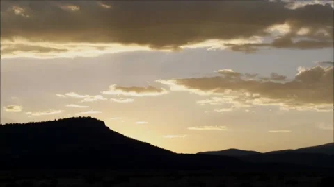 Dramatic Sunset Over Mountain Ridge with Golden Clouds 스톡 동영상 327269737