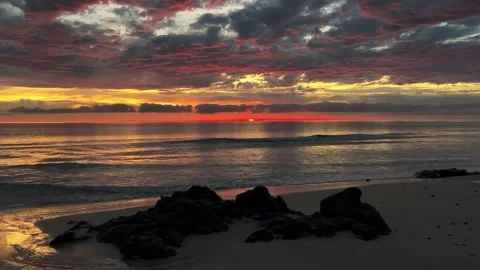 Dramatic sunset over ocean beach Stock Footage 345799208