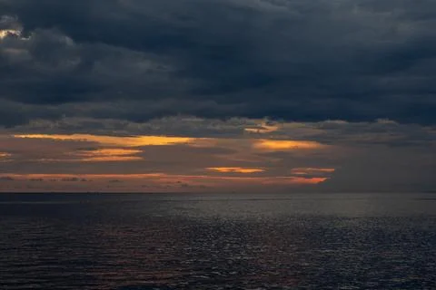 Dramatic Sunset Over the Ocean Stock Photos