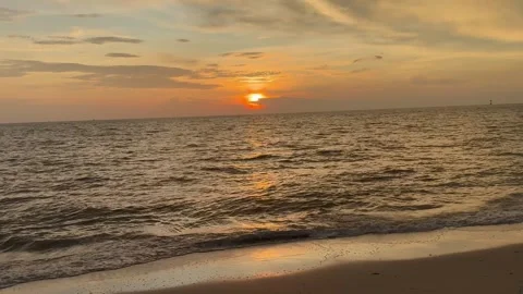 Dramatic Sunset Over the Ocean with Stunning Clouds Stock Footage 304314886