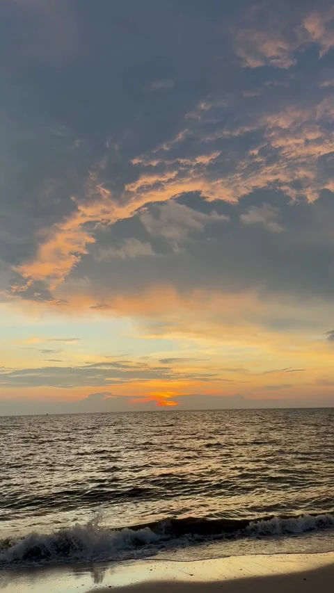 Dramatic Sunset Over the Ocean with Stunning Clouds Stock Footage 304314887