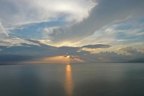 Dramatic Sunset Over Open Ocean with Crepuscular Rays, South China Sea Stock Photos
