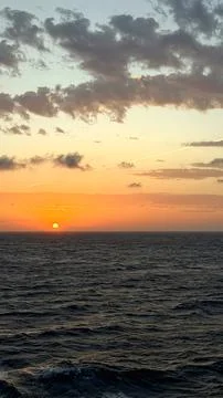 Dramatic Sunset over the Open Sea Stock Photos