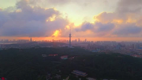 Dramatic Sunset over Qingdao Cityscape and TV Tower Stock Footage 330731445