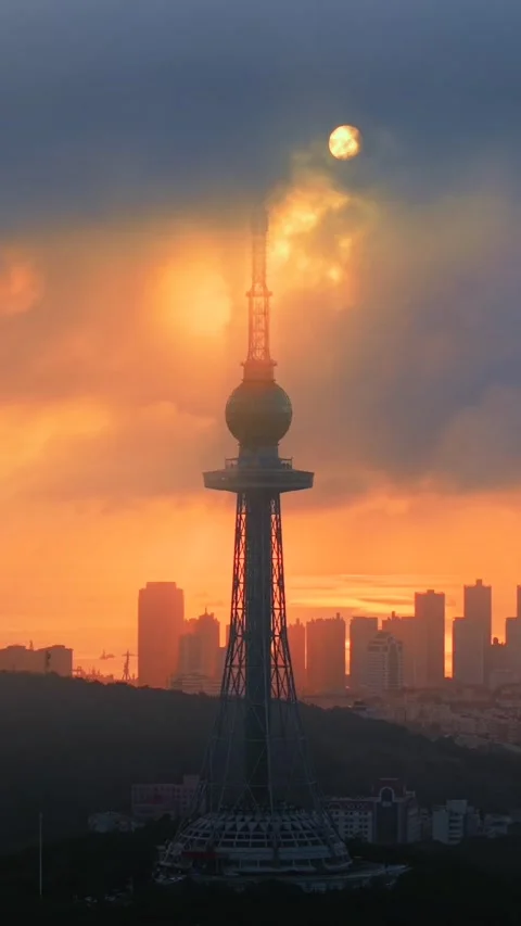 Dramatic Sunset over Qingdao TV Tower with Moon Stock Footage 330733030