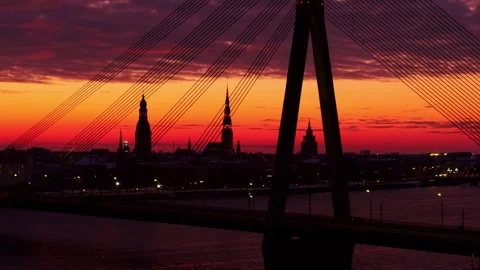 Dramatic sunset over Riga’s skyline, vibrant hues illuminating city silhouettes Stock Footage 304101215