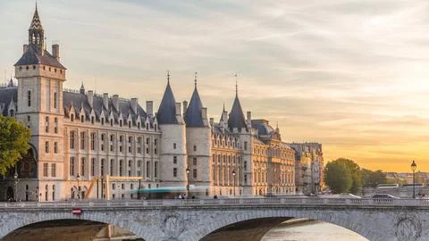 Dramatic sunset over river Seine and Conciergerie timelapse in Paris, France Stock Photos