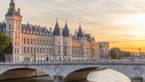 Dramatic sunset over river Seine and Conciergerie timelapse in Paris, France Stock Photos