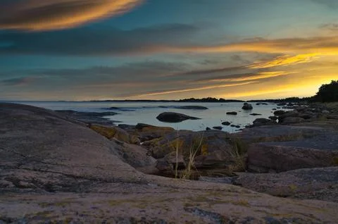 Dramatic Sunset Over Rocky Skerry Coast by Calm Sea. In Sweden, Darvik. Stock Photos
