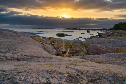 Dramatic Sunset Over Rocky Skerry Coast by Calm Sea. In Sweden, Darvik. Stock Photos