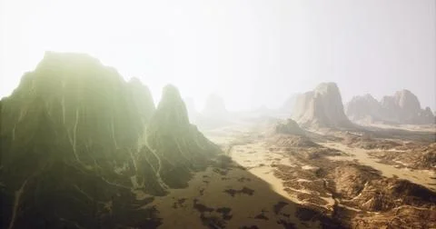 Dramatic sunset over rugged mountain landscape in a serene desert environment Illustrazione stock