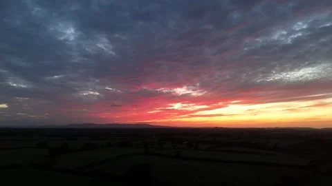 Dramatic Sunset Over Rural Landscape Beneath Colorful Evening Sky Stock Footage 337851156