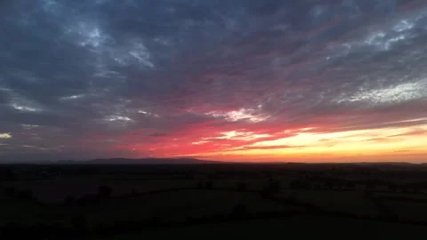 Dramatic Sunset Over Rural Landscape Beneath Colorful Evening Sky Video stock 337851222