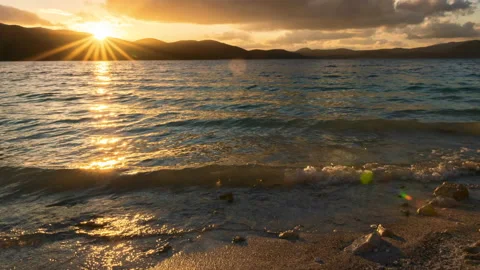 Dramatic sunset over salda lake with crashing waves Stock Footage 139888446