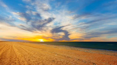 Dramatic sunset over sandy sea beach Stock Footage 331427911