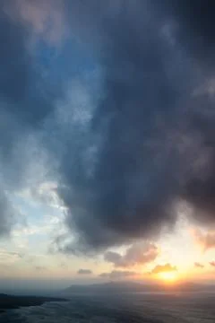 Dramatic sunset over Santorini caldera sea Stock Photos