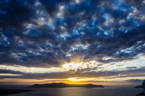 Dramatic sunset over Santorini caldera sea Stock Photos