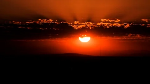 Dramatic Sunset Over Silhouetted Landscape 스톡 동영상 327269232