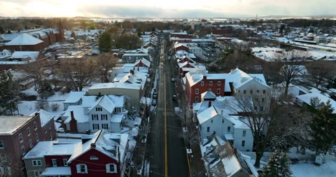 Dramatic sunset over small town in USA. Winter Christmas holiday snow on Stock Footage 172519752