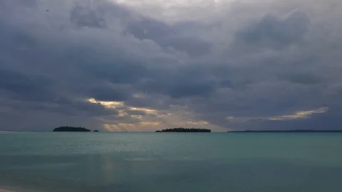 Dramatic sunset over small tropical islands Stock Footage 107891604