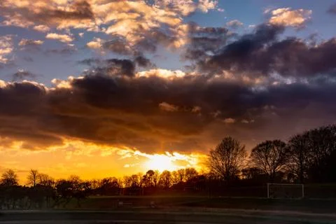 Dramatic sunset over soccer field Stock Photos