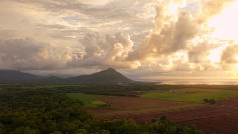Dramatic sunset over tropical mountains and fields in Mauritius. Stock Footage 304630364
