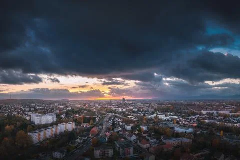 Dramatic Sunset Over a Vibrant Cityscape Stock Photos