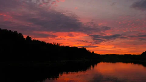 Dramatic sunset in red-orange colours aerial view in 4K Stock Footage 129944018