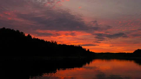 Dramatic sunset in red-orange colours aerial view in 4K Stock Footage 129944450