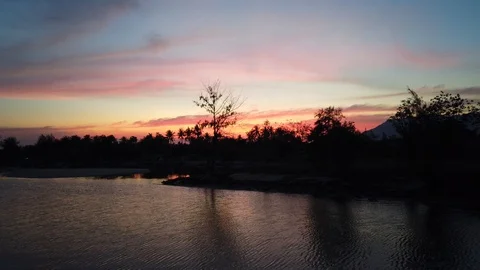 Dramatic sunset with reflection on river Stock Footage 100891515