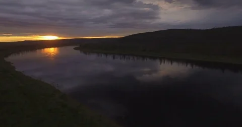 Dramatic sunset on the river among the forest, aerial Stock Footage 79128791