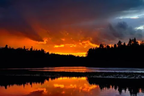 Dramatic sunset on the river Chirko-Kem. Karelia, Russia Stock Photos