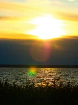 Dramatic sunset on river landscape background Stock Photos