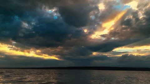Dramatic sunset in the sea against the backdrop of mountains. 4K 60 fps footage. Stock Footage 108663645