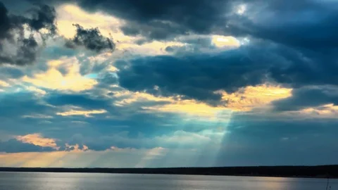 Dramatic sunset in the sea against the backdrop of mountains. 4K 60 fps footage. Stock Footage 108664089