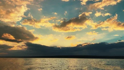 Dramatic sunset in the sea against the backdrop of mountains. 4K 60 fps footage. Stock Footage 108664239