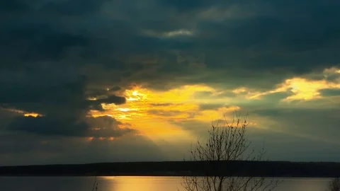 Dramatic sunset in the sea against the backdrop of mountains. 4K 60 fps footage. Stock Footage 108664241