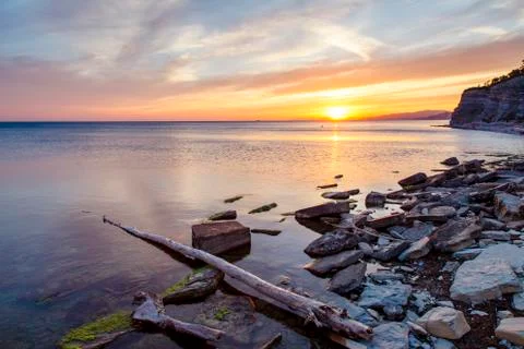 Dramatic sunset on the sea coast in the area of Gelendzhik resort Orange sun set Stock Photos
