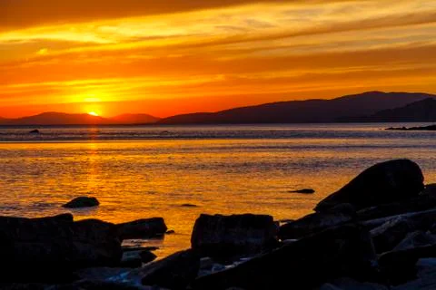 Dramatic sunset on the sea coast in the area of Gelendzhik resort Orange sun set Stock Photos