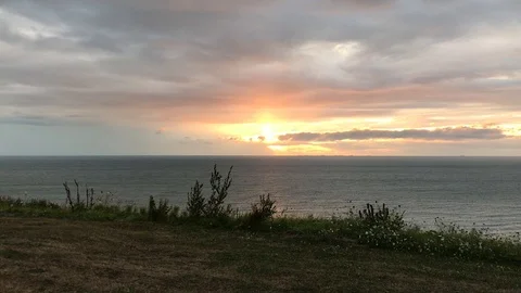 Dramatic Sunset at the sea - pan Stock Footage 111058773