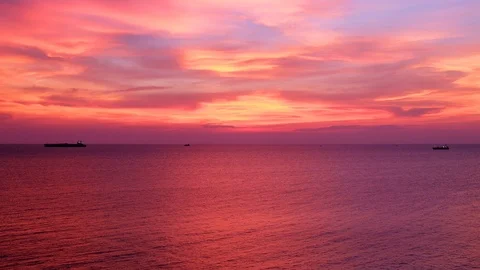 Dramatic sunset seascape pink and orange sky twilight view with silhouette 動画素材 92521911